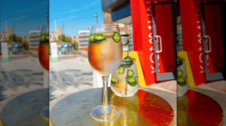 A glass of rosé with jalapeños