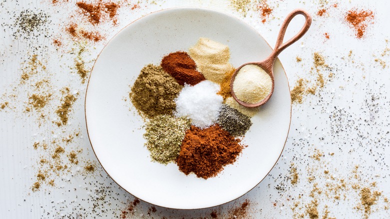Various spices on a white plate
