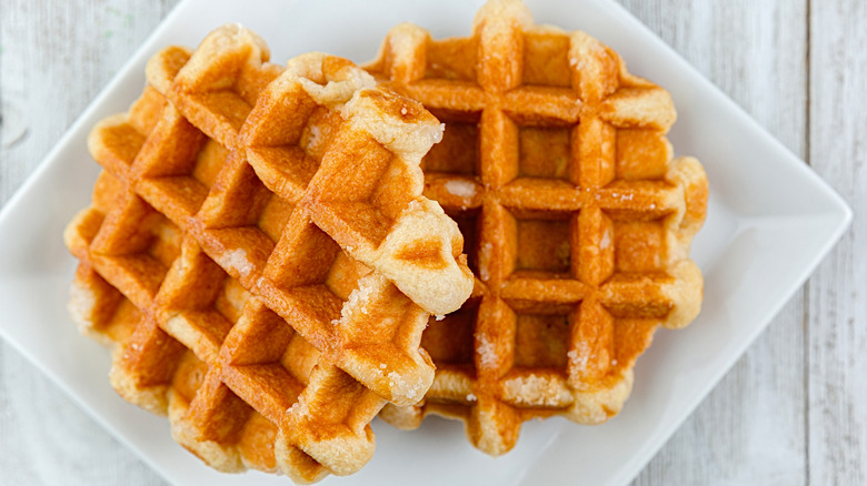 Plain Belgian waffles on white plate