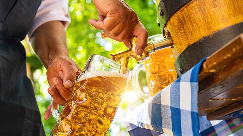 Man pouring beer from keg