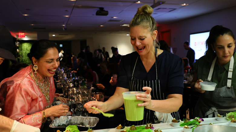 Maneet Chauhan and Amanda Freitag garnishing dishes