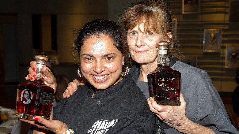 Maneet Chauhan and Deb Paquette holding Jack Daniel's