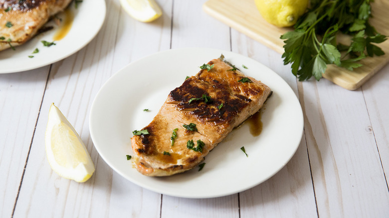 glazed salmon on white plate