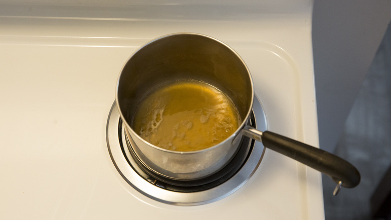 apple cider simmering on stove