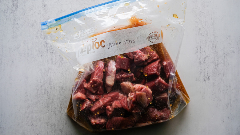 steak tips marinating in bag