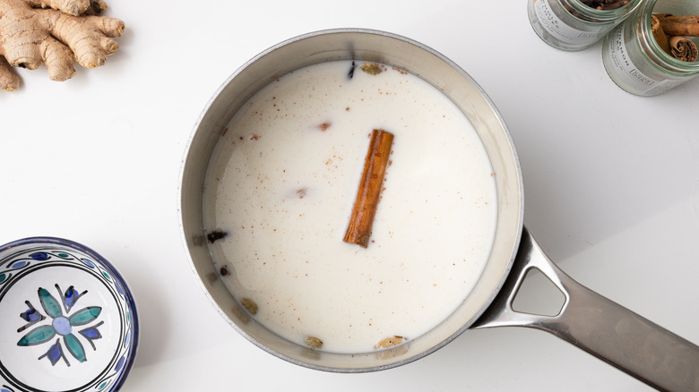milk and spices in saucepan 