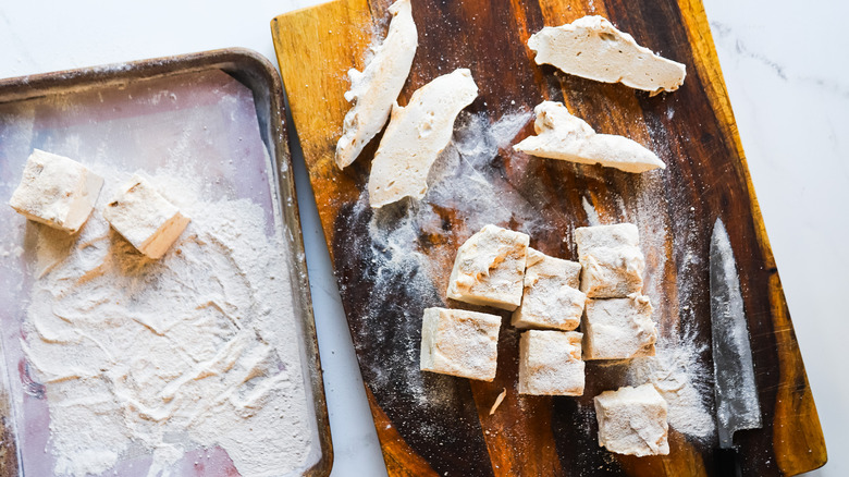 Knife trimming fresh marshmallow