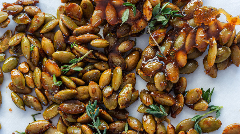 Close up on maple seeds with thyme leaves