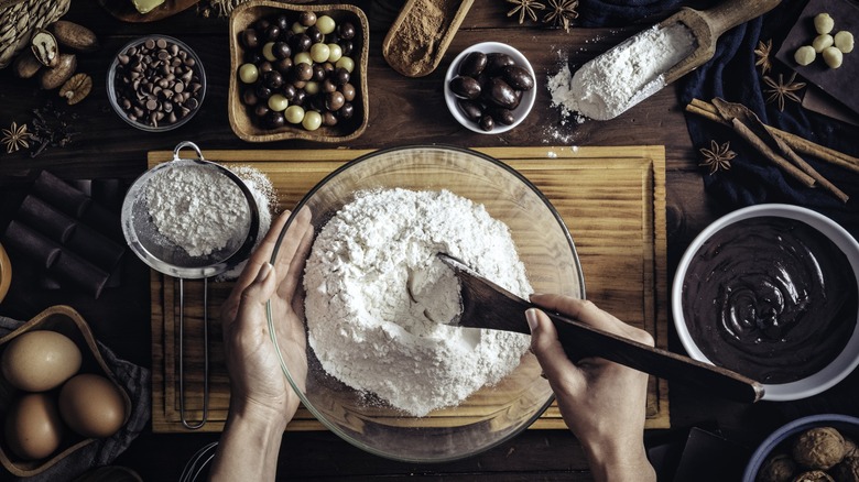 Woman's hands making chocolate baked goods