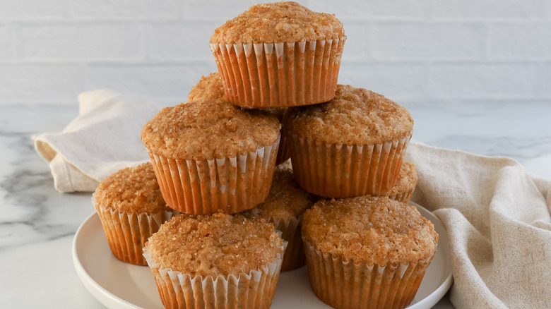 mpale walnut muffins stacked on plate