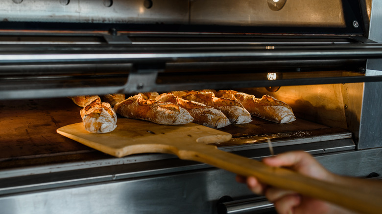 Baguettes being removed from oven