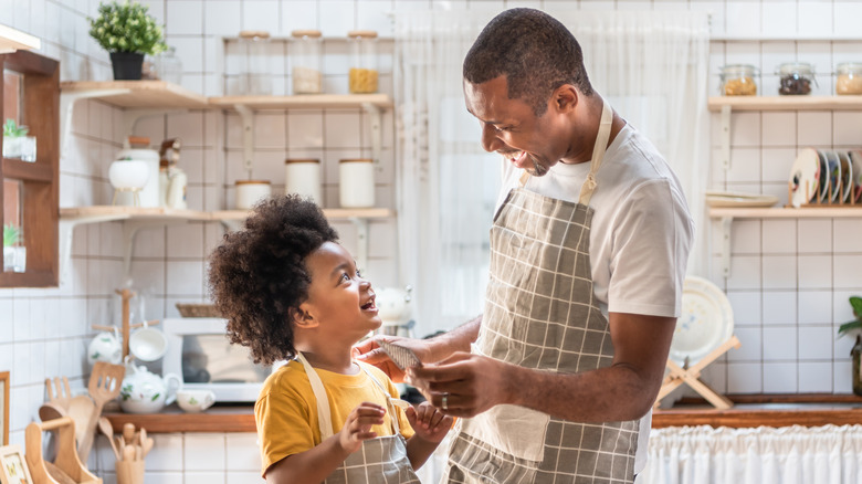 Father and son cooking together