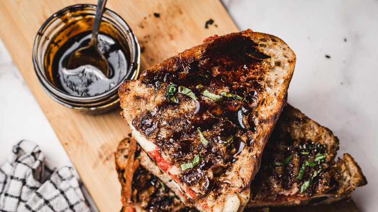 Stack of grilled cheese halves with sauce