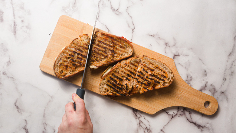 Slicing grilled cheese in half