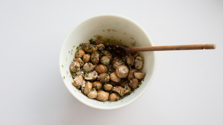 bowl of mushrooms in marinade