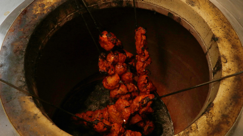 Tandoori chicken baked in tandoor