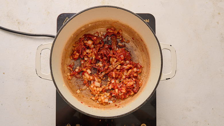 Tomato and onion mixture in a Dutch oven