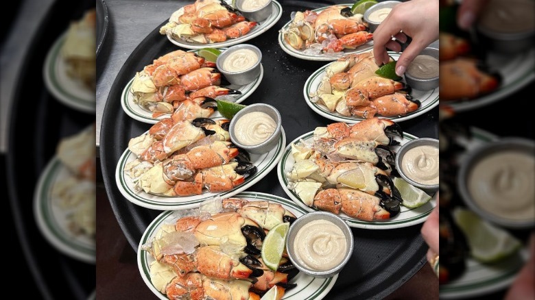 Stone crabs on plates with sauce