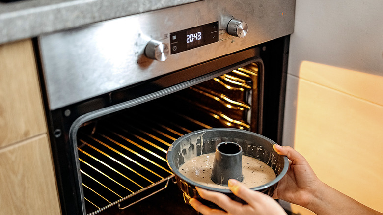 bundt cake being put in the oven