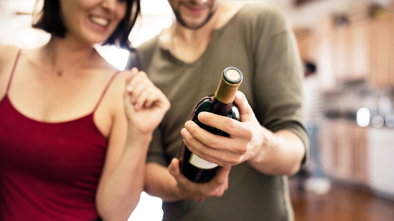 Couple looking at wine