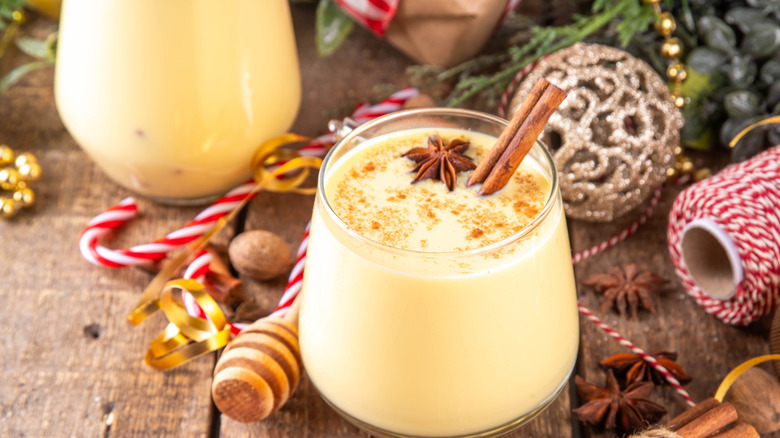 Holiday eggnog with decorations on the table