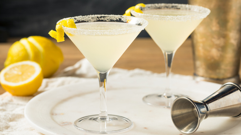 Two lemon drop martinis with sugar rims and lemon garnish