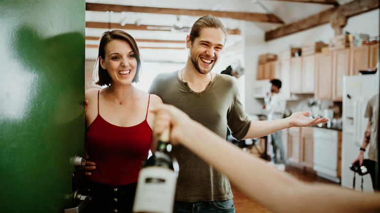 guest gifting wine bottle