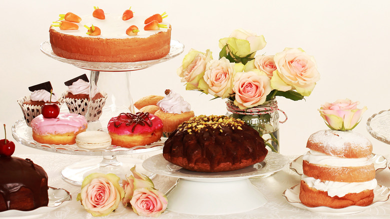 dessert table with cakes donuts