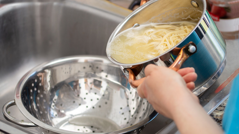 straining pasta