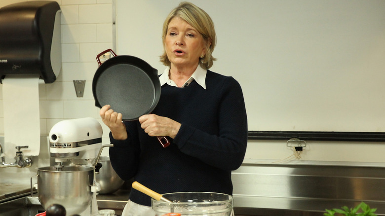 Martha Stewart holding skillet