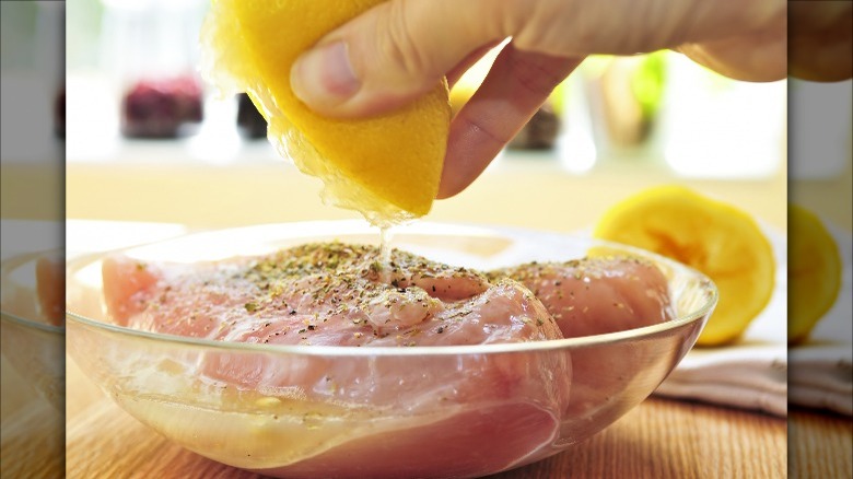 Chicken marinating in oil and lemon