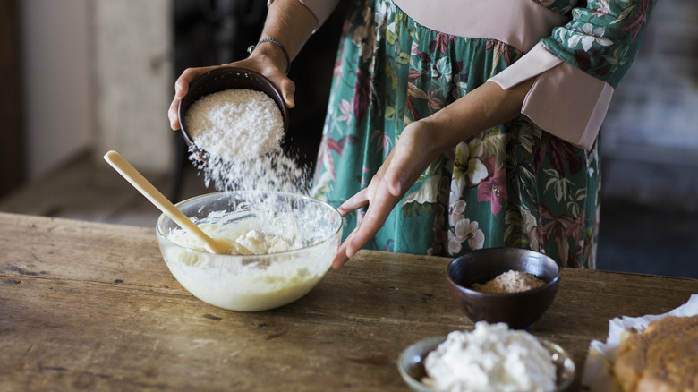 Woman mixing batter glass bowl