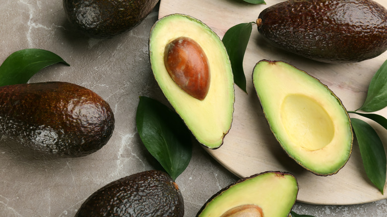 avocados halved in a group