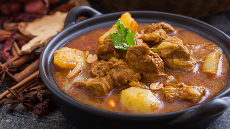 Massaman curry in black bowl 