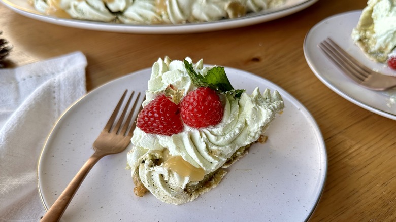 Slice of matcha berry pavlova wreath