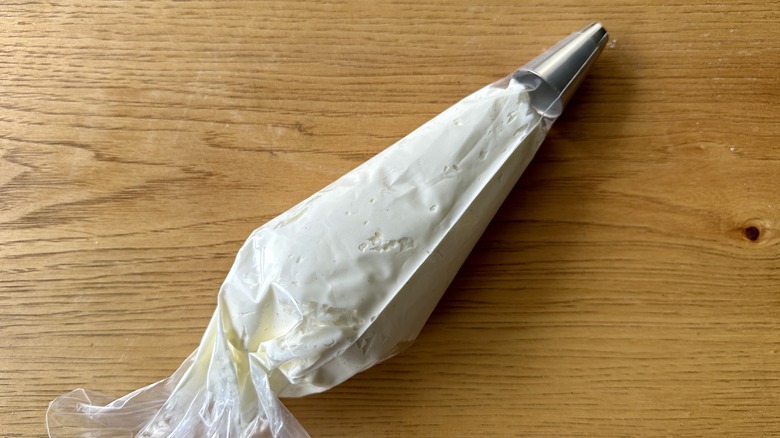 Whipped mascarpone cream in piping bag