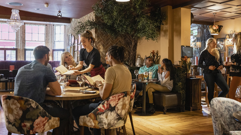 People ordering food in restaurant