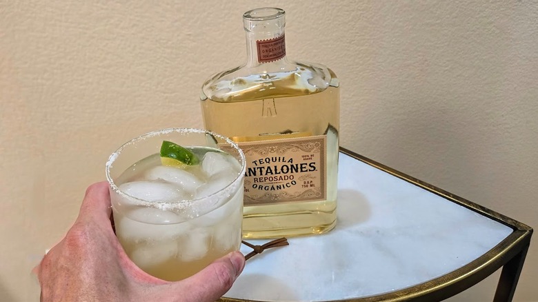 Toasting Pantalones tequila with cocktail