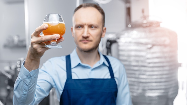 worker inspecting mead