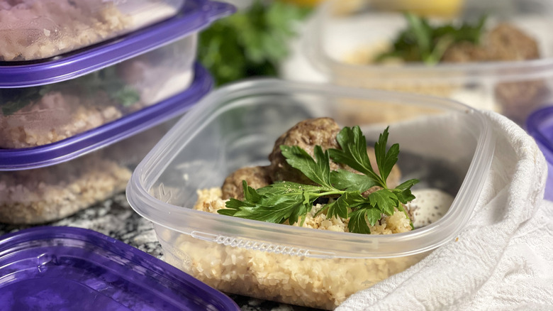 rice, meatballs, herbs in container