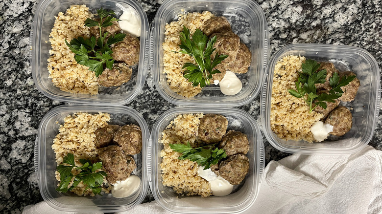 containers with meatballs and rice