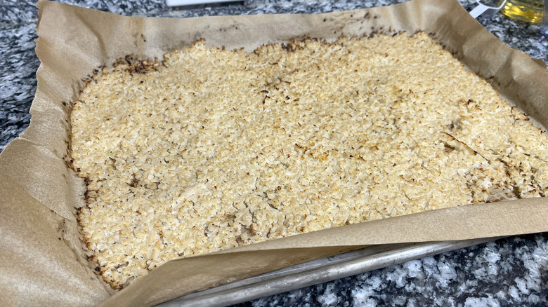 browned rice on baking sheet