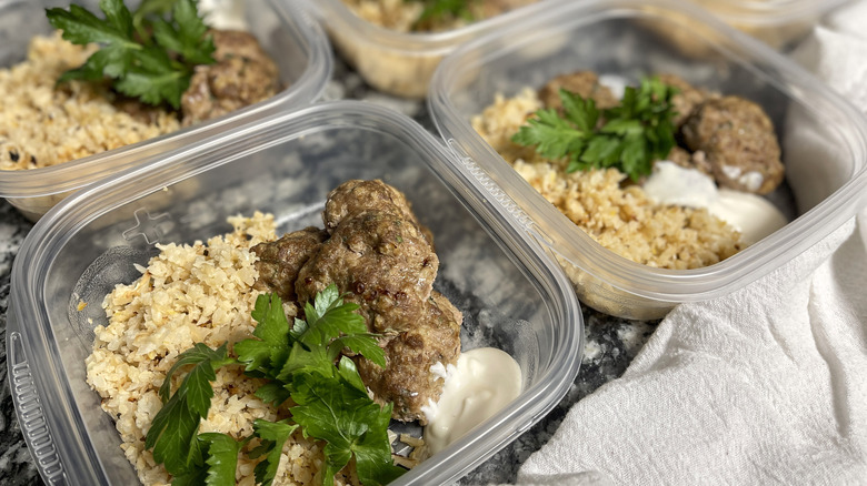 containers with meatballs and rice