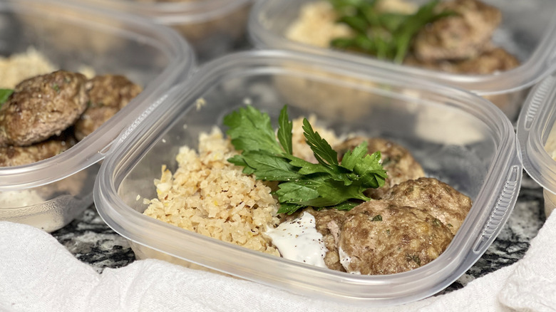 rice, meatballs, herbs in container