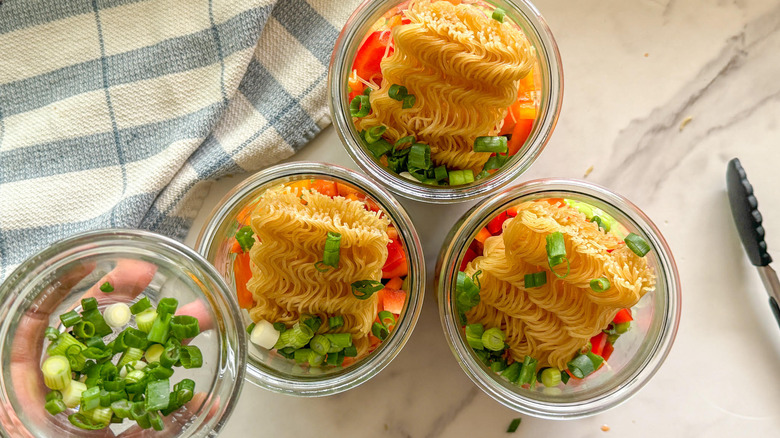 adding scallions to jars