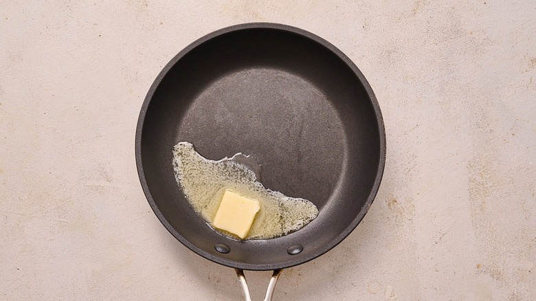 heating butter in a skillet