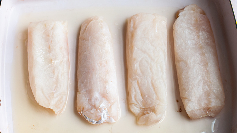 oiled pan of cod fish