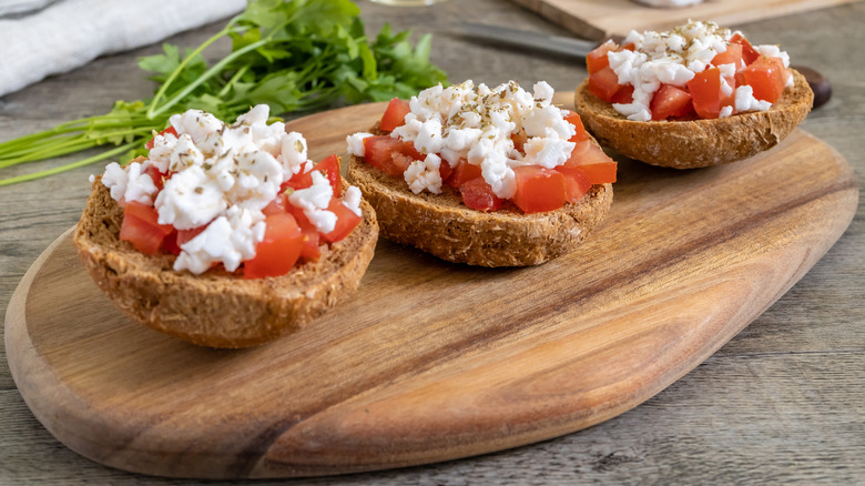 Dakos on wooden platter