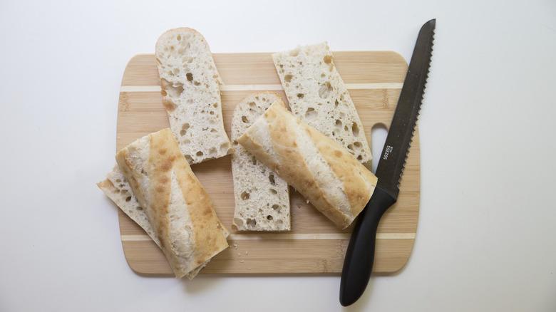 sliced baguette on cutting board