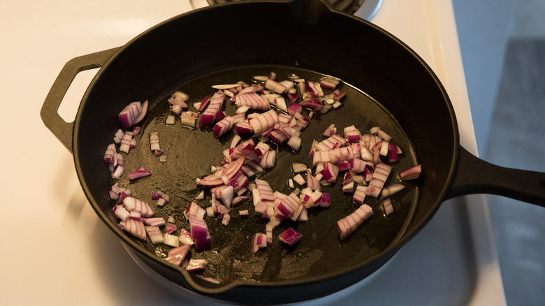 red onion cooking in pan